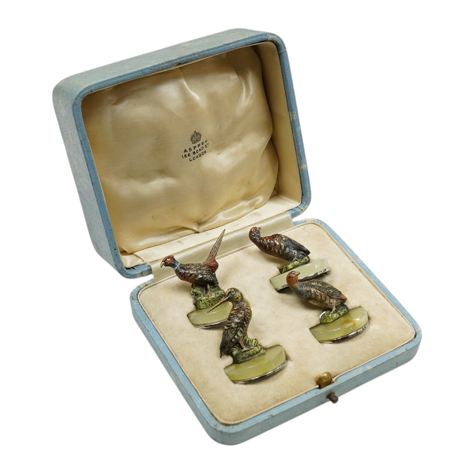 A cased Asprey set of four cold painted bronze and chrome plated novelty game bird menu holders, tallest 5cm high. Condition - good